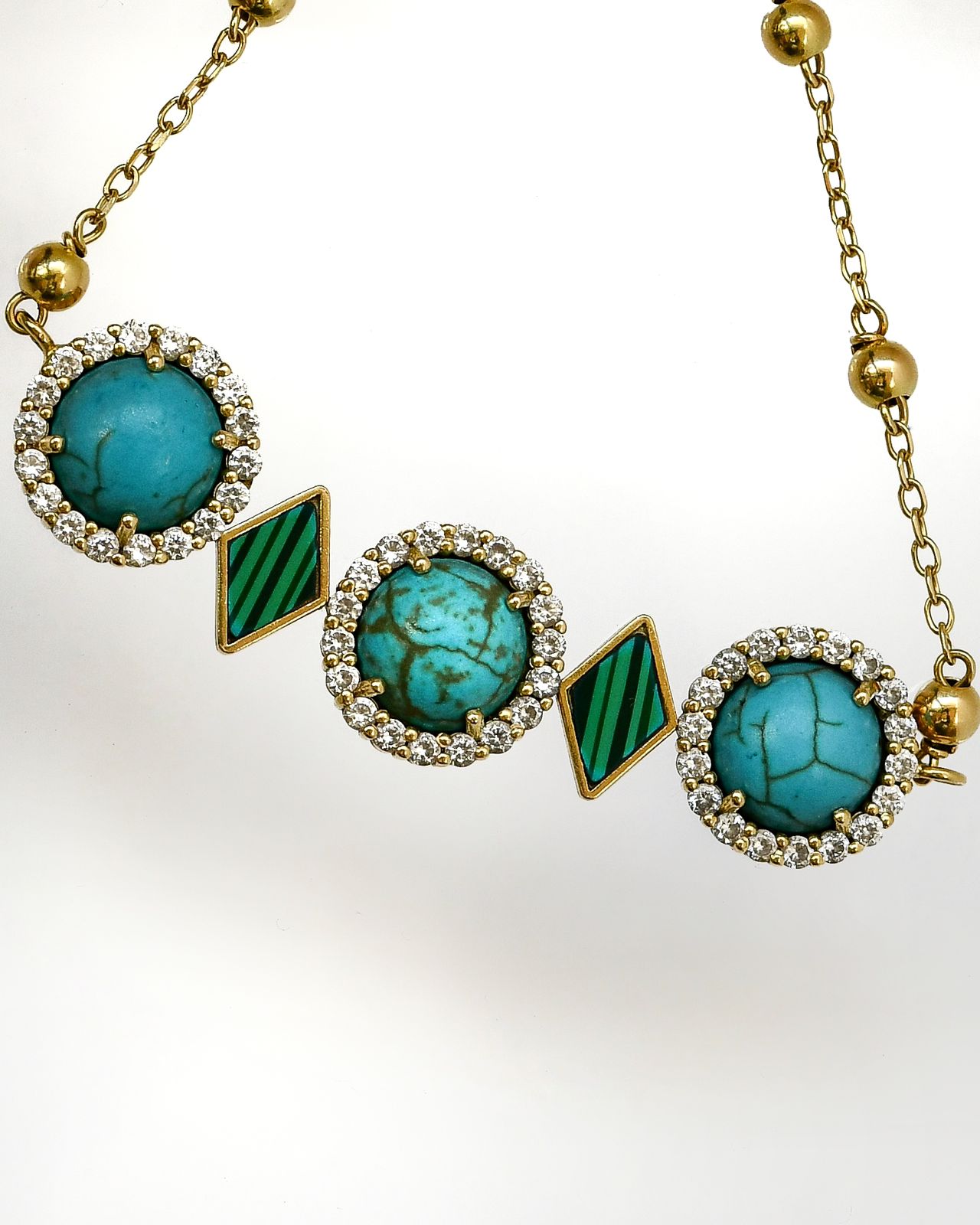 The souls bracelets 18kgold with turquoise and malachite the length of the pendant 6cm the weight 9gram