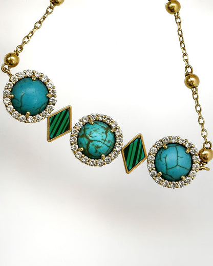 The souls bracelets 18kgold with turquoise and malachite the length of the pendant 6cm the weight 9gram