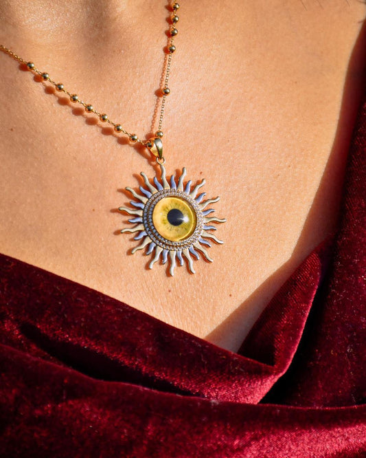 The sun 18k gold with real eyes prints and diamonds 16g length 4cm for the pendant 40cm for the necklace